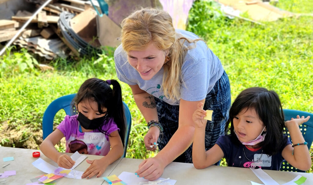 Taylor Wehri of submersion14 interacts with children in Guatemala.